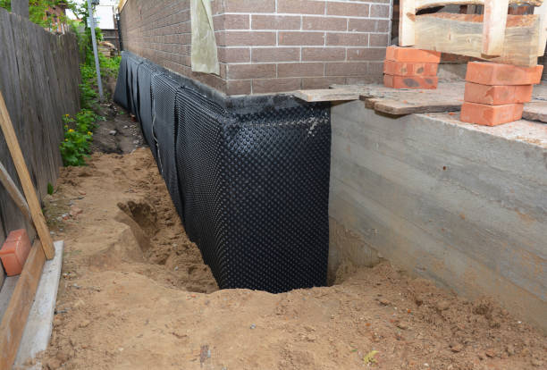 Happy homeowners after waterproofing job in Williamston